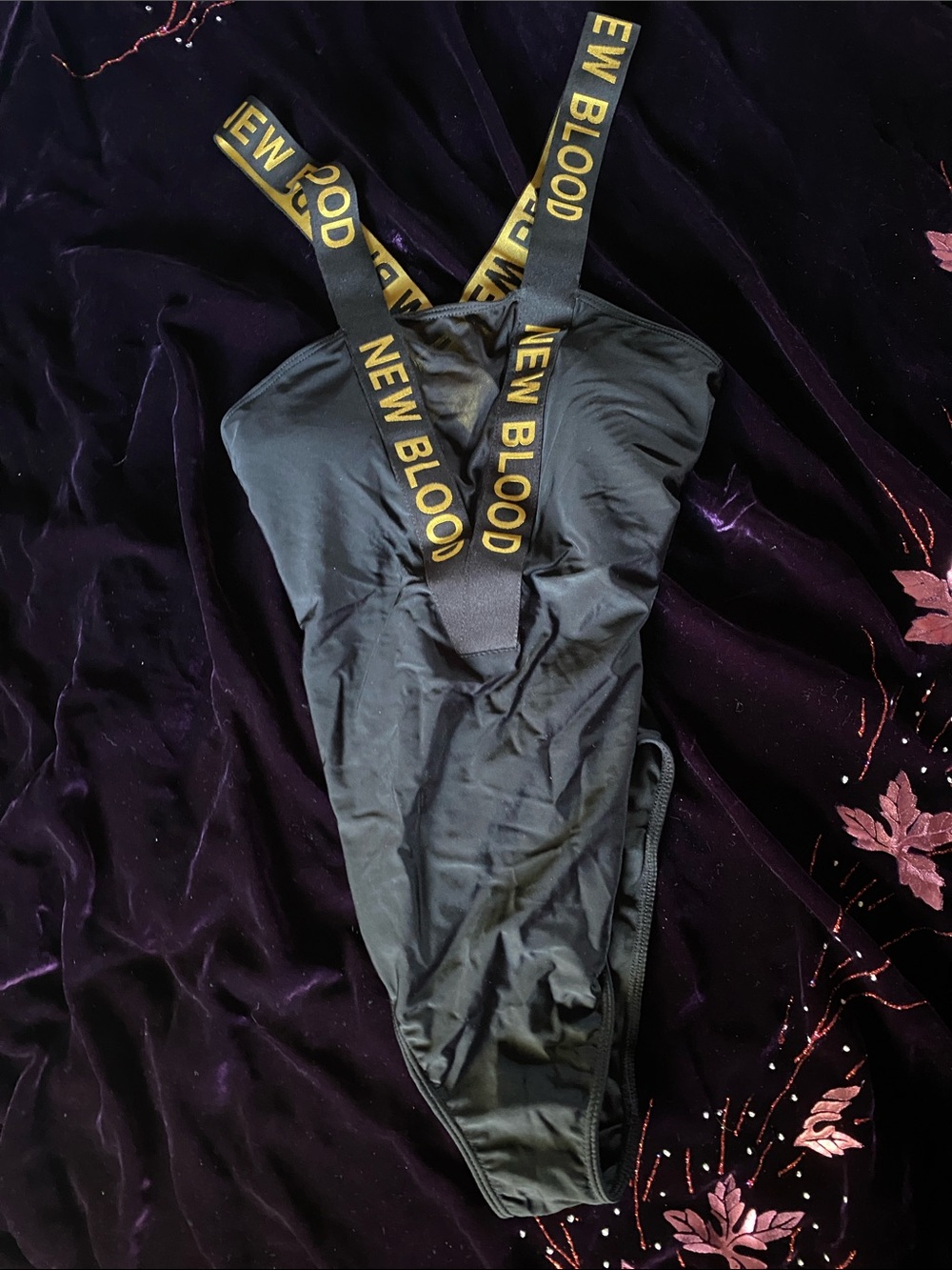 New Blood Women's Black One-Piece Swimsuit with Gold Logo Straps